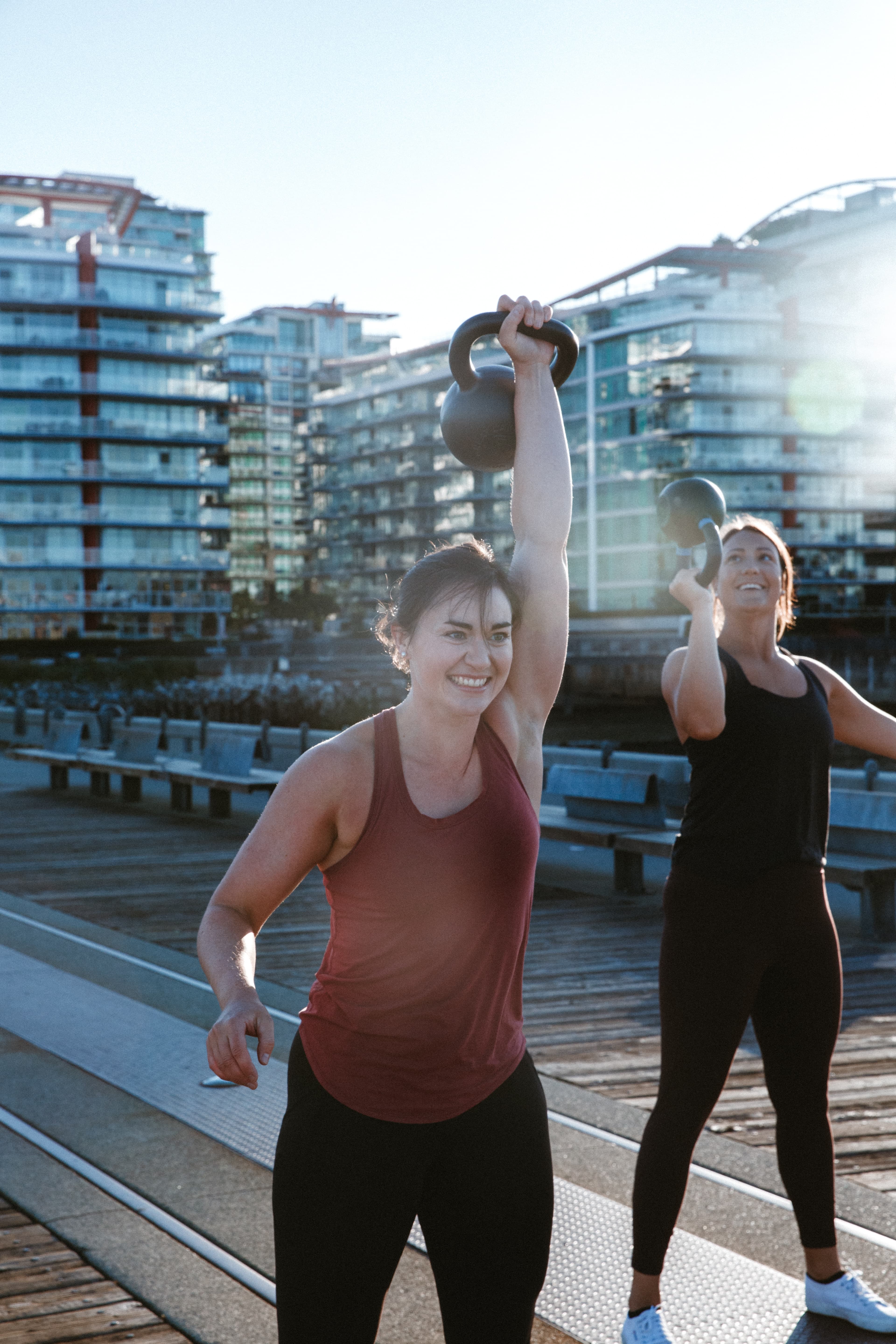 Briana and Jess doing kettlebell exercises