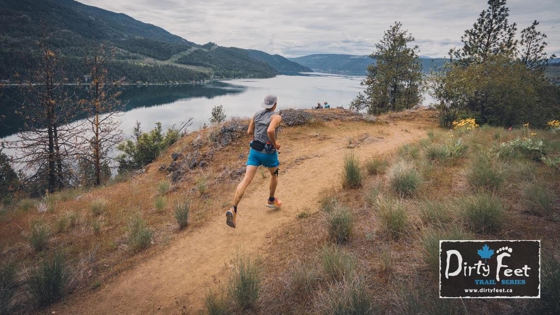 Trail runner beside a lake